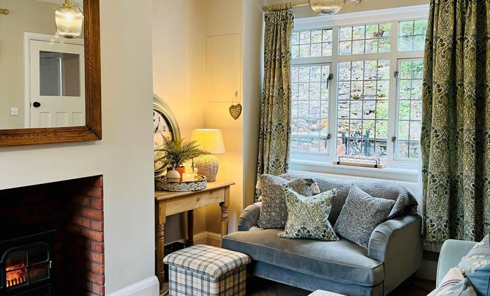 Our cosy, quiet, dual aspect living room. Perfect for an evening with the family playing games or chilling watching TV. NOTE: The living room fire is